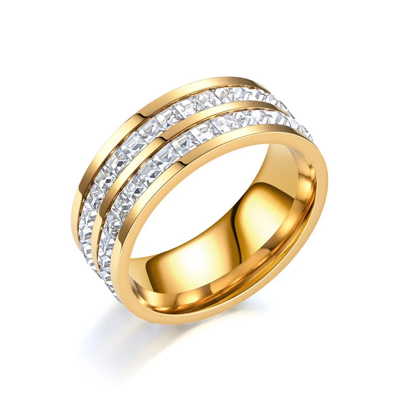 Stainless steel geometric star ring with zircon inlay in gold finish on white background
