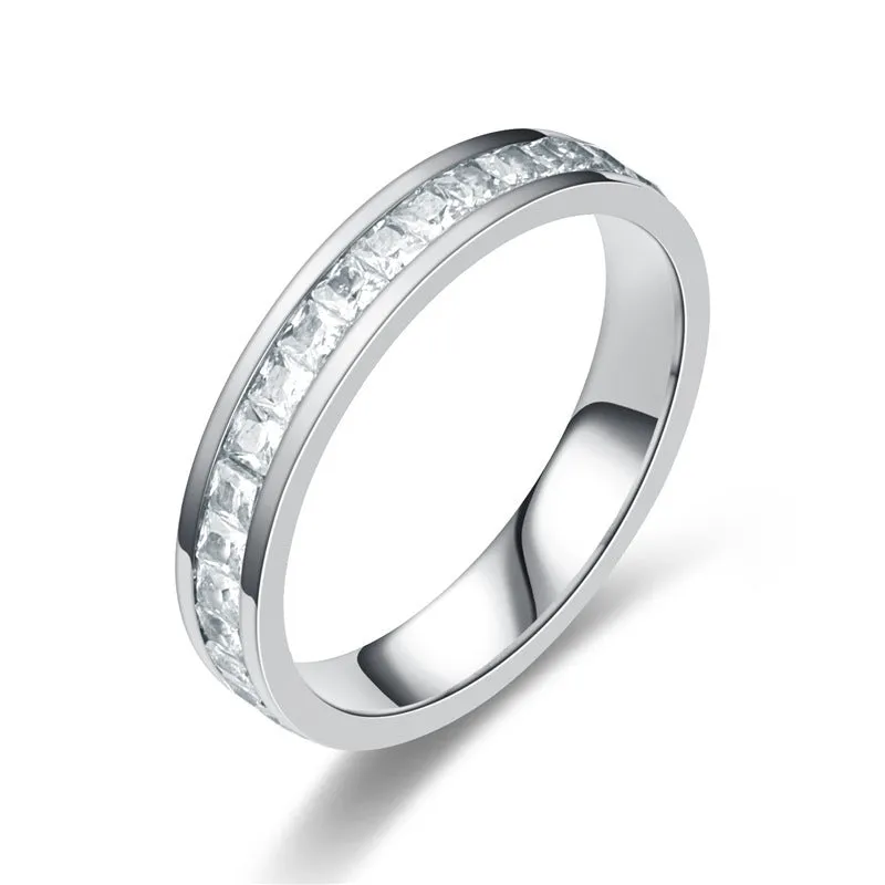 Stainless steel geometric star ring with zircon inlay in gold finish on white background