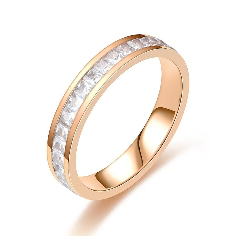 Stainless steel geometric star ring with zircon inlay in gold finish on white background