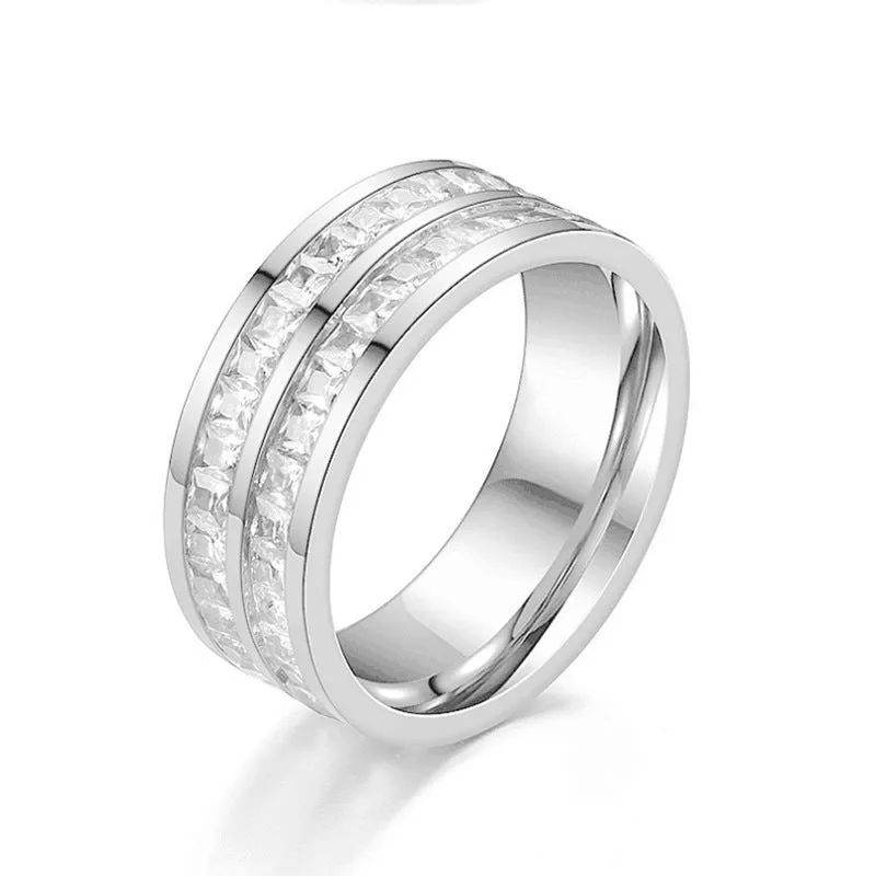 Stainless steel geometric star ring with zircon inlay in gold finish on white background