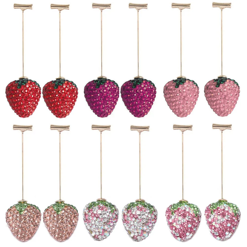 Red strawberry charm stud earrings with spot drill finish on zinc alloy.