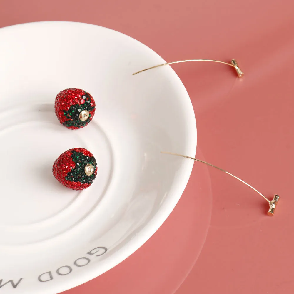 Red strawberry charm stud earrings with spot drill finish on zinc alloy.