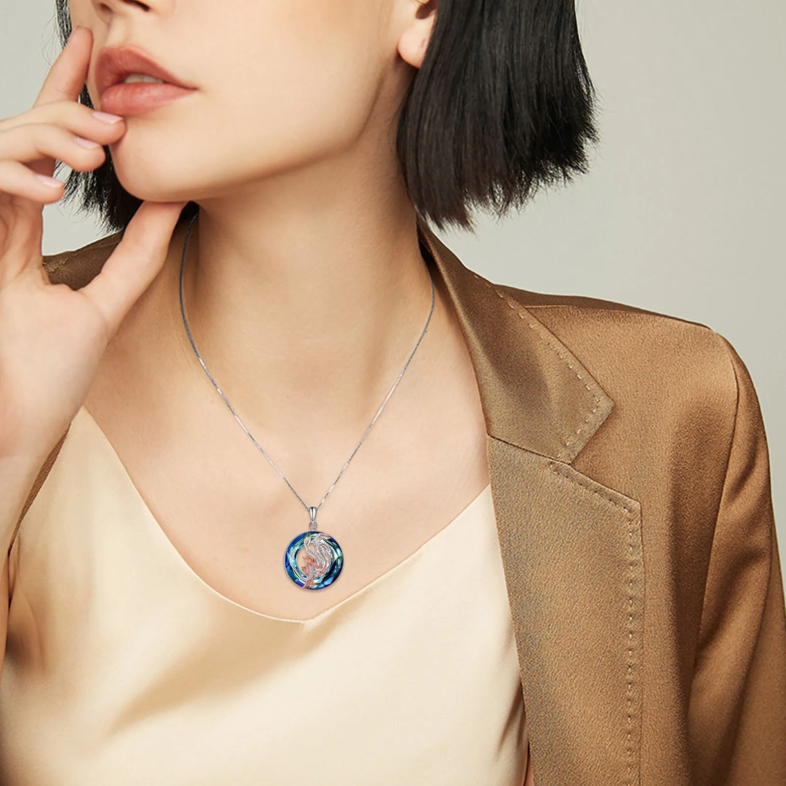 Nirvana Phoenix pendant necklace in sterling silver with crystal stone on silver box chain