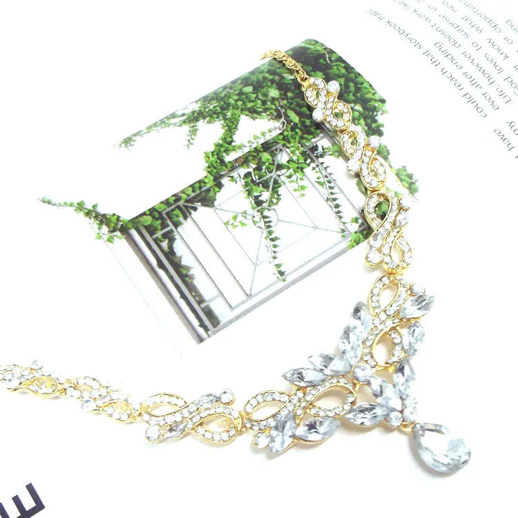 Gold alloy clavicle chain necklace with bow pendant on display