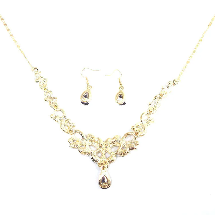 Gold alloy clavicle chain necklace with bow pendant on display