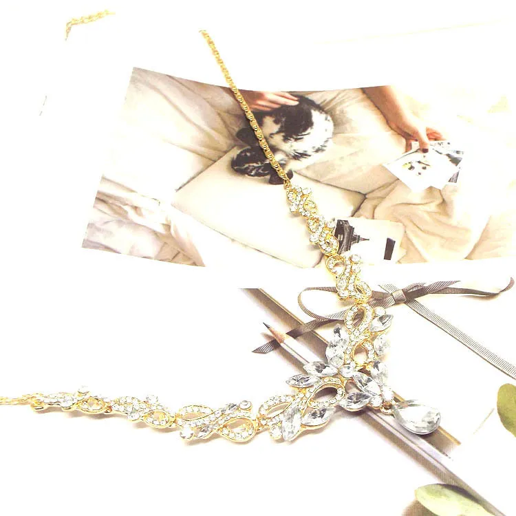 Gold alloy clavicle chain necklace with bow pendant on display