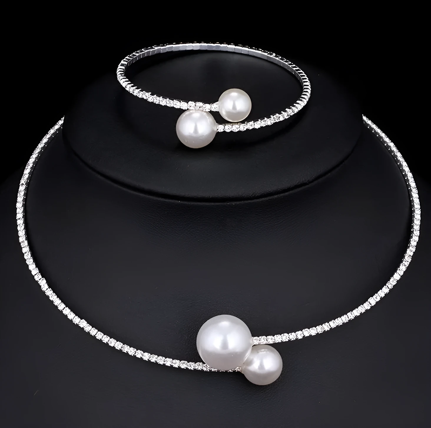 Bridal crystal pearl diamond drill collar necklace and bracelet set in gold and silver tones on white background