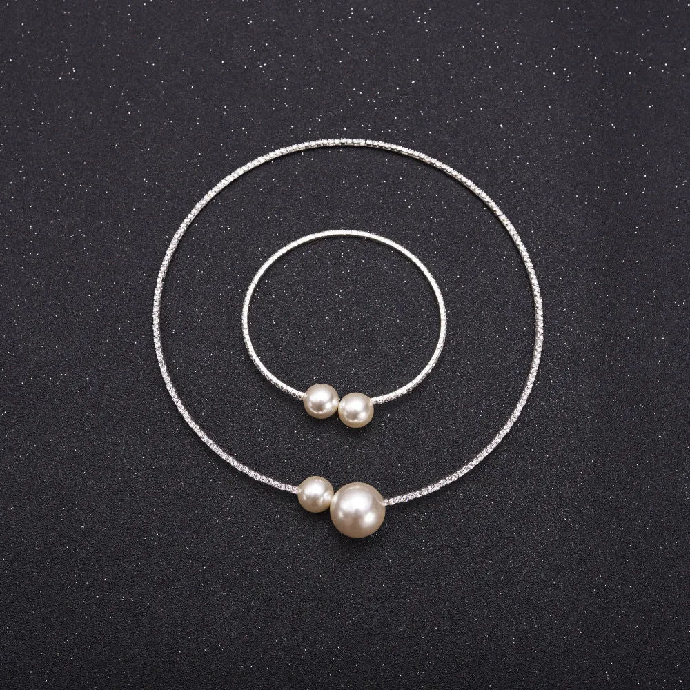 Bridal crystal pearl diamond drill collar necklace and bracelet set in gold and silver tones on white background
