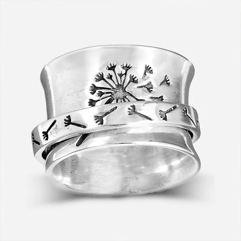 Silver rotatable flower ring showing floral design on alloy band