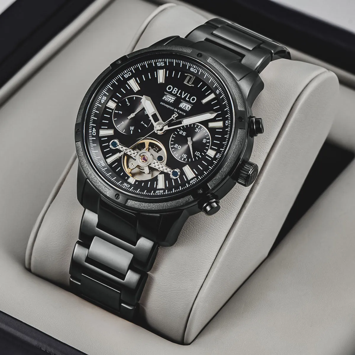 Men's multi-functional hollowed fashion watch with date display, steel strap, silver blue colour