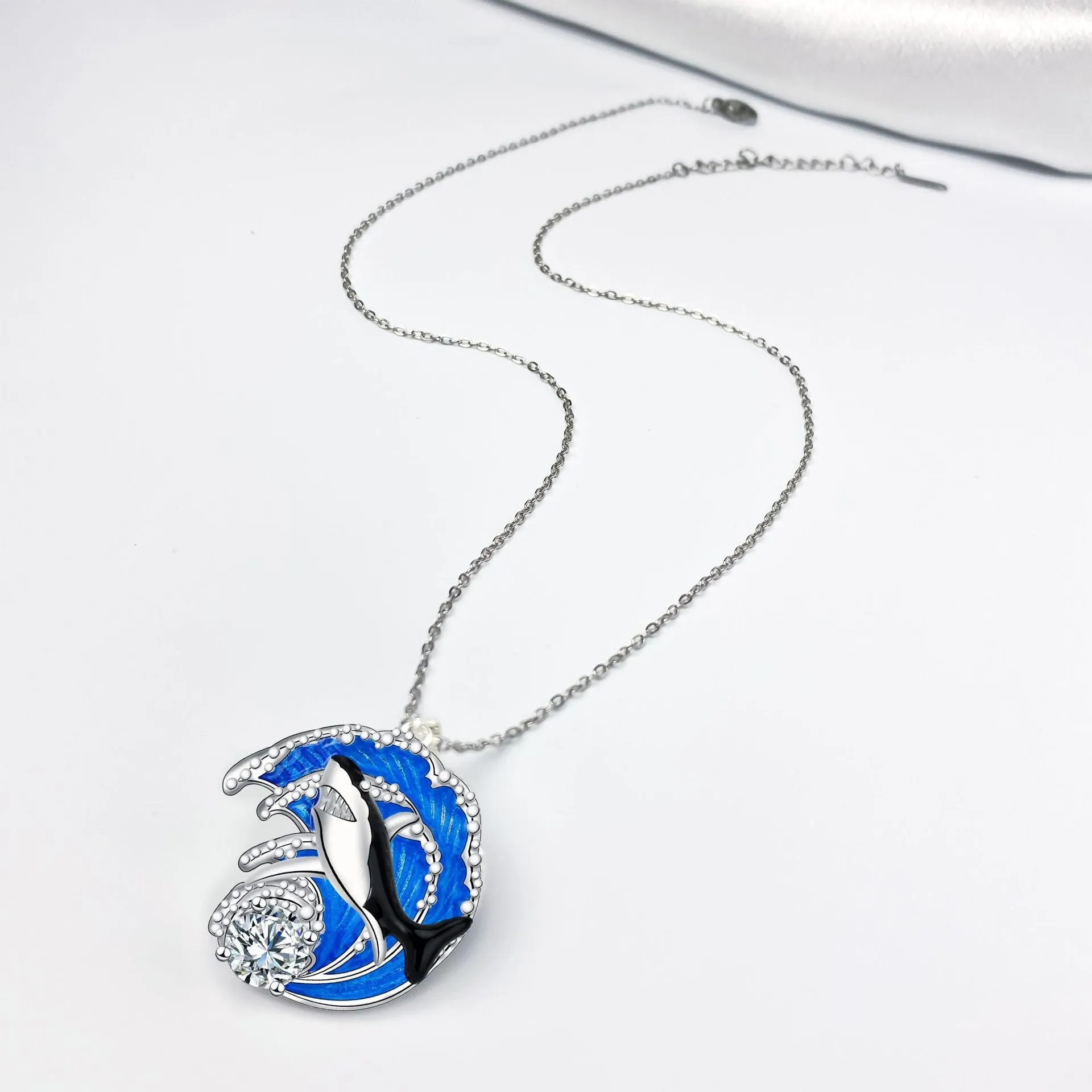 Silver tone shark pendant necklace on cross chain with adjustable 41-50cm length