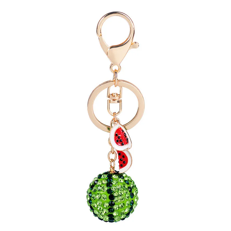 Green watermelon-shaped zinc alloy keychain with decorative accents, shown on a key ring.