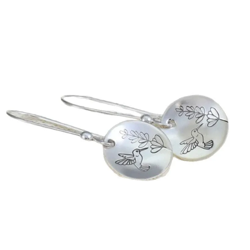 Silver glossy round women's earrings with bird and leaf motif