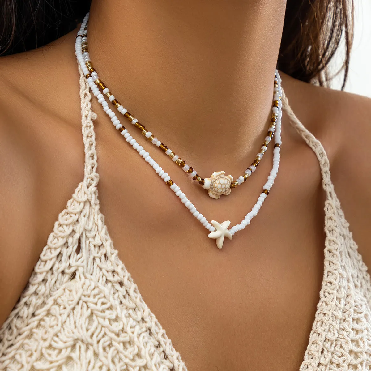 Starfish shell necklace for women, vacation style, ball bead chain, acrylic pendant with five-pointed star and tassel, white colour, set of 2