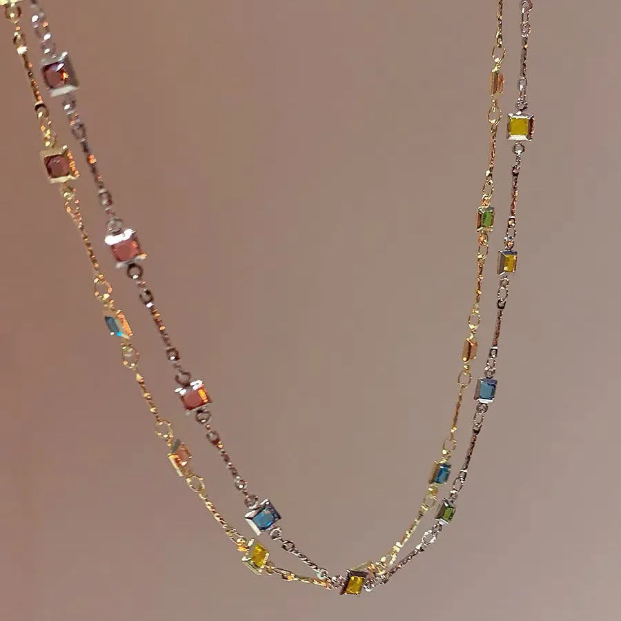 Square colour geometric alloy clavicle chain necklace with artificial crystal detail in gold tone.
