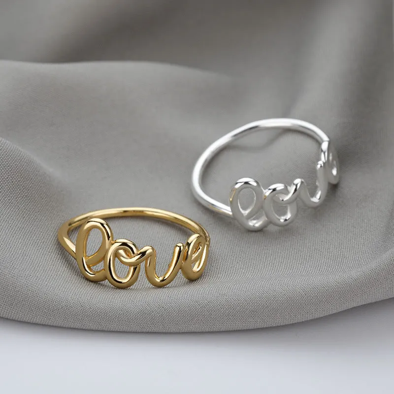 Small unisex copper LOVE ring with engraved text in gold finish for couples
