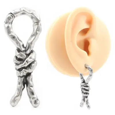 Close-up of Creative Bends And Hitches copper cartilage earrings with a 4mm gauge and retro bending design.