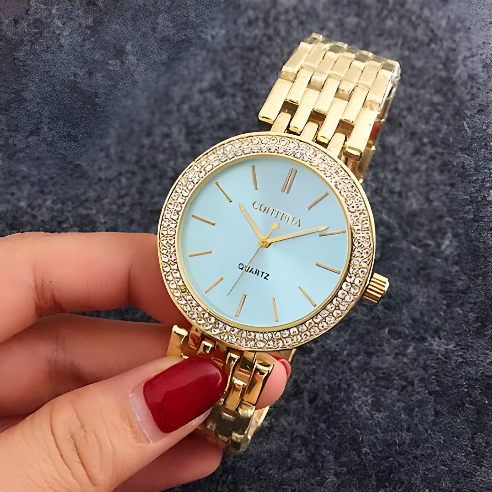 Women's round alloy case quartz watch with stainless steel band in gold, silver, and rose gold
