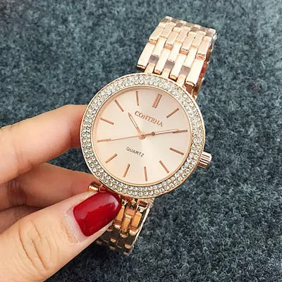 Women's round alloy case quartz watch with stainless steel band in gold, silver, and rose gold