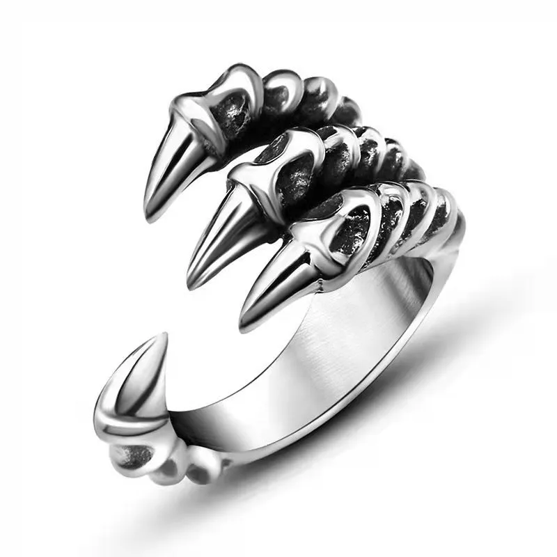 Adjustable paw ring in electroplated metal on index finger, dragon motif, unisex fashion jewelry