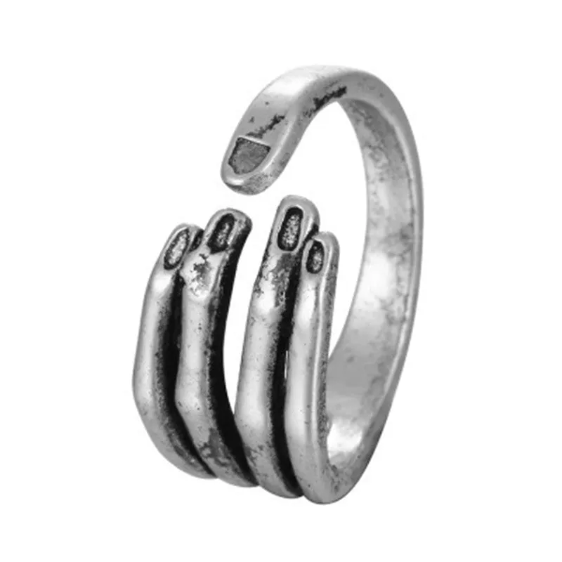 Adjustable paw ring in electroplated metal on index finger, dragon motif, unisex fashion jewelry