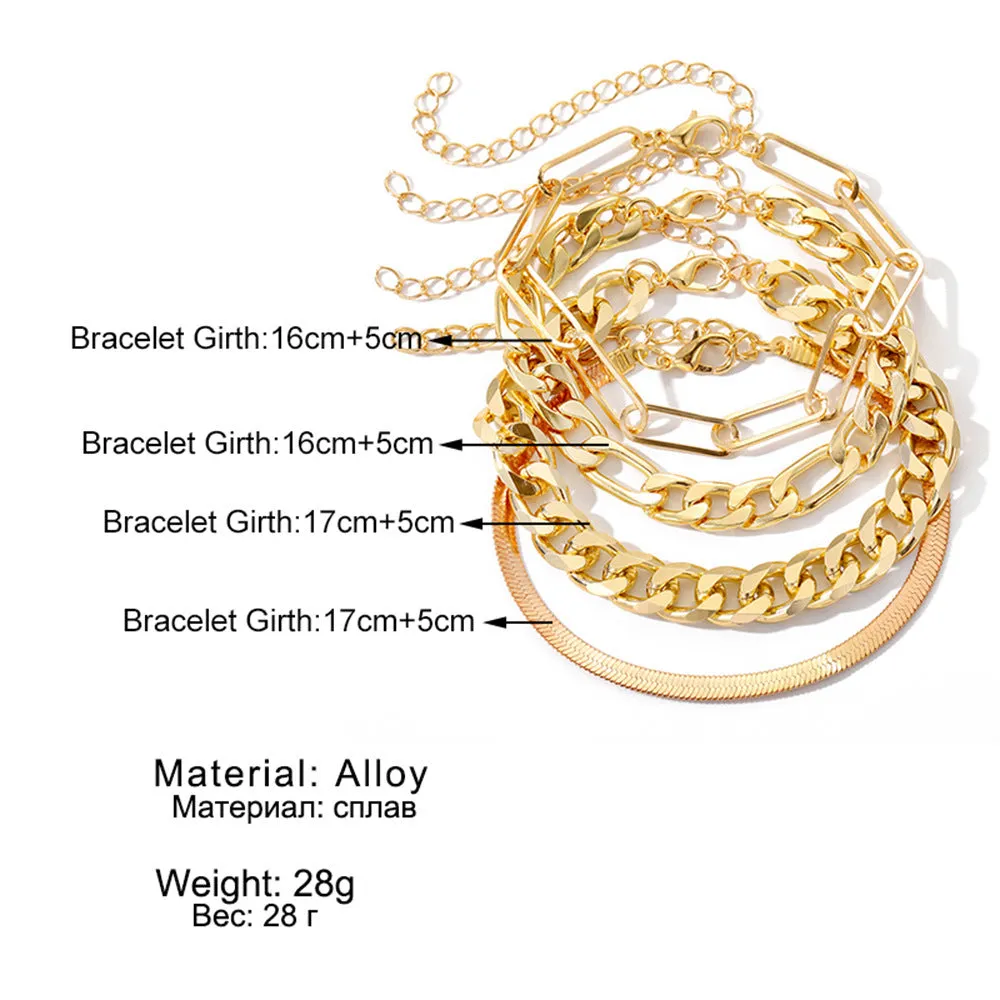 Set of four gold electroplated alloy bracelets on a surface