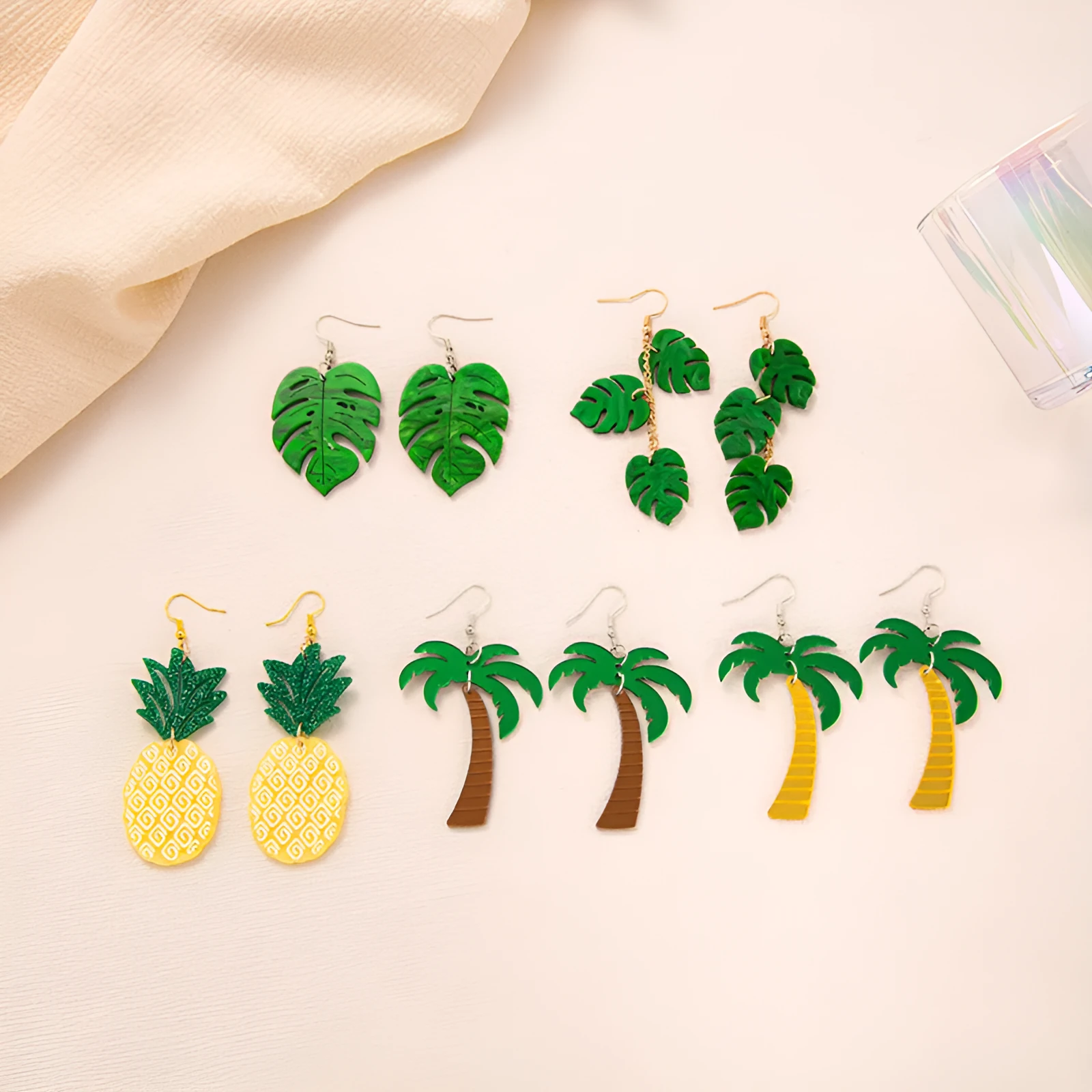 Jackfruit-shaped dangle earrings in acrylic and alloy, shown in one of five colour styles.