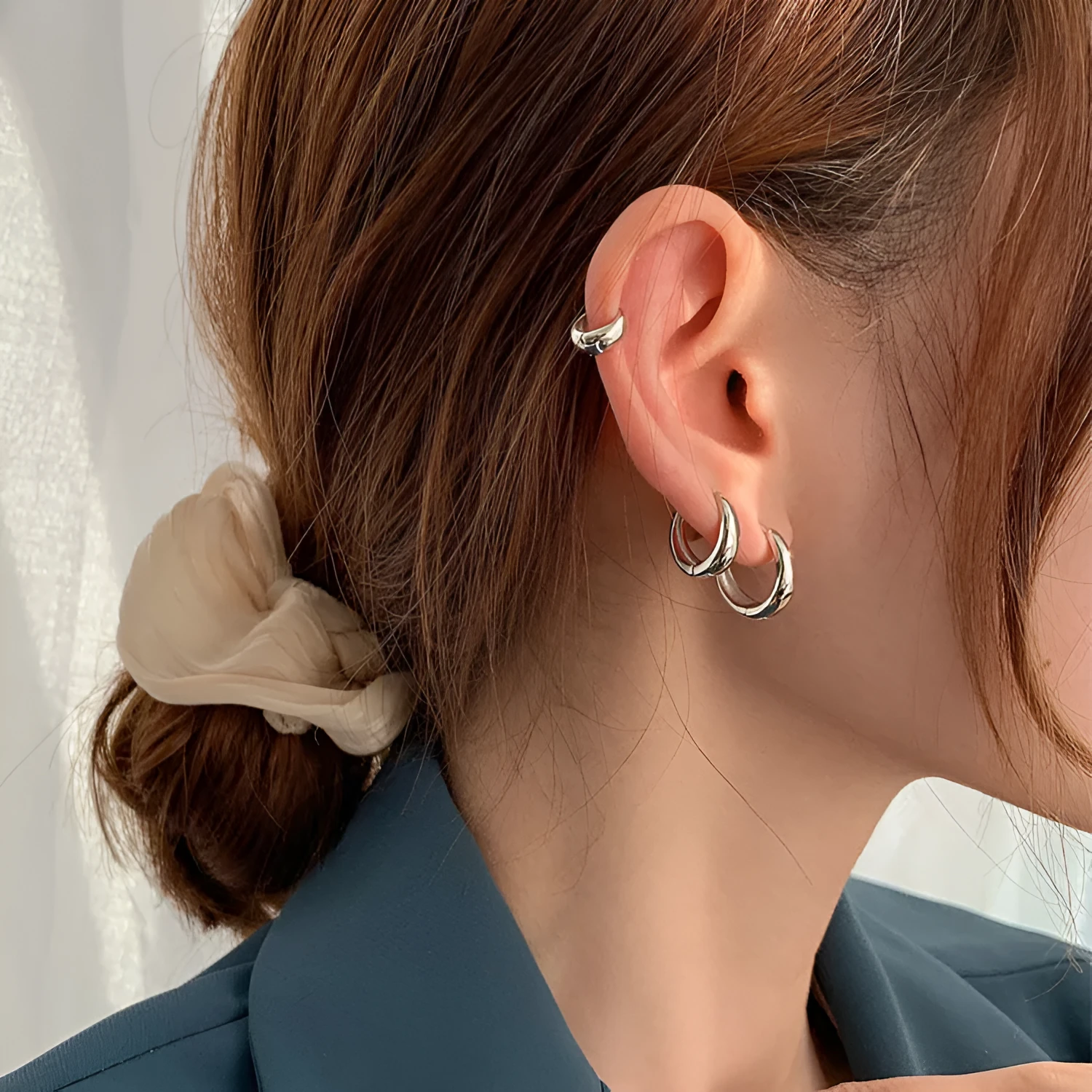 Retro-style geometric water drop earrings for women in gold and silver finishes, showing large, medium, and small sizes.