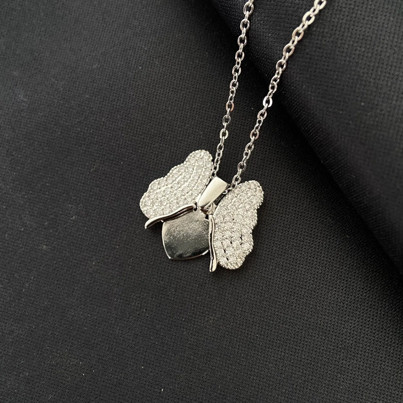 Silver electroplated titanium steel butterfly pendant necklace with openable design on clavicle-length chain