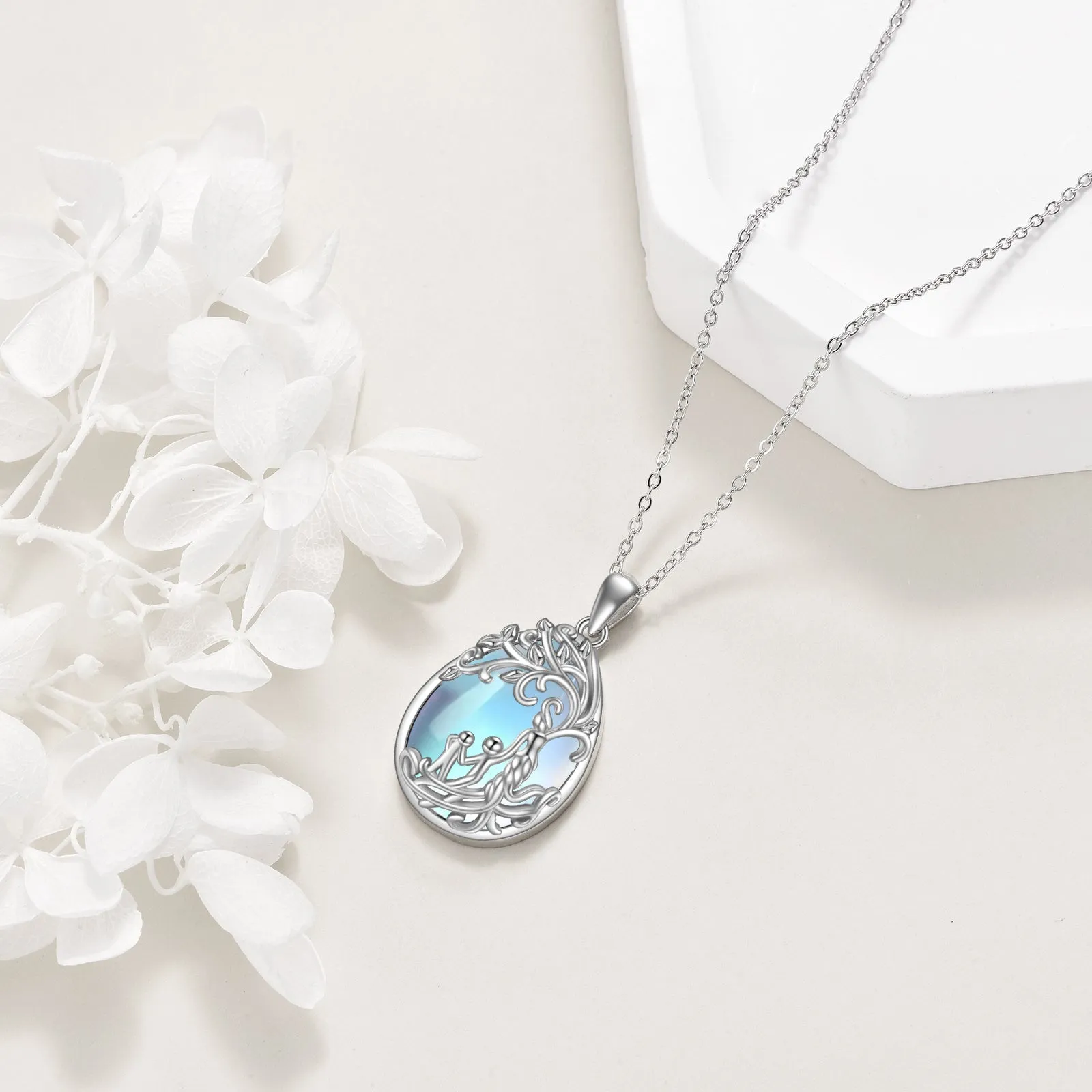 Sterling silver moonstone tree of life pendant with white gold plating on 18-inch cable chain