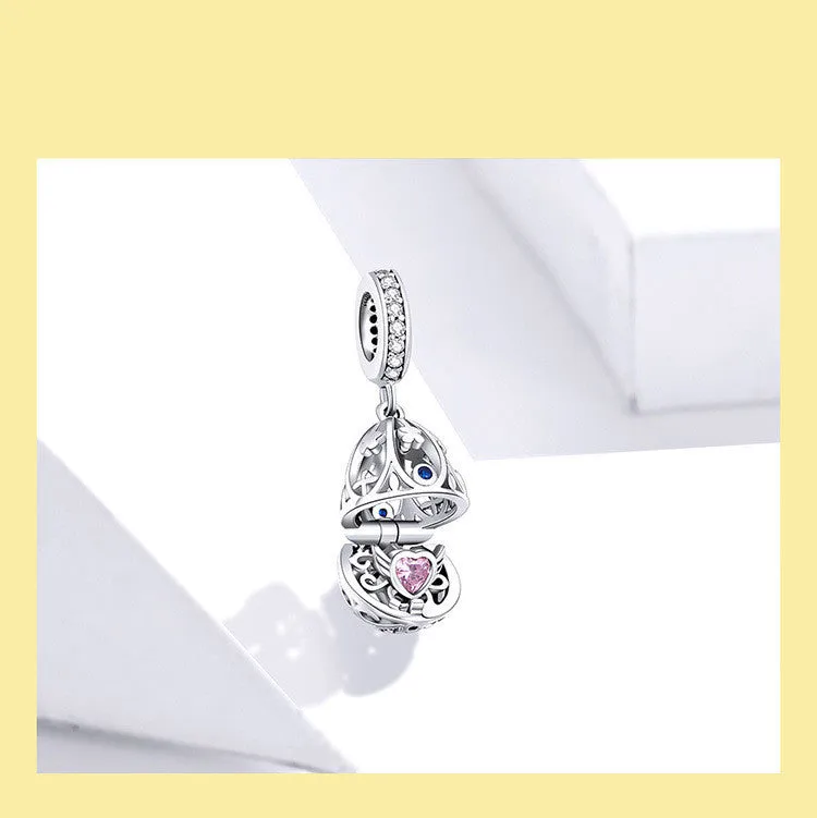 Silver electroplated loose bead pendant 2.3cm high 1cm wide on plain background