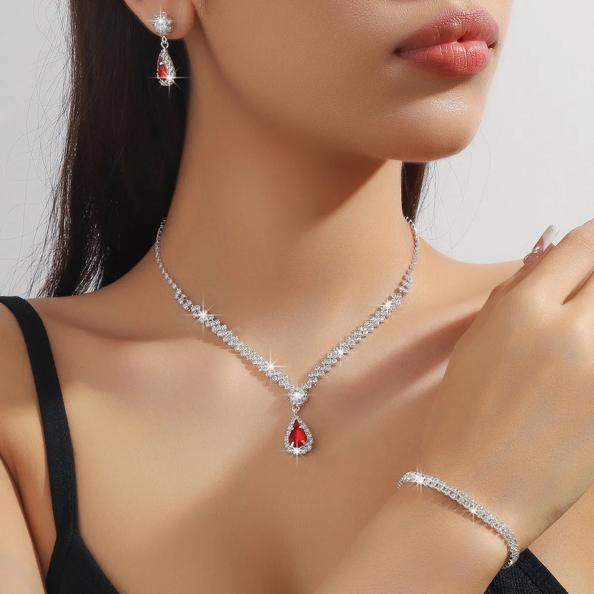 Claw chain necklace and earrings set with water drop rhinestone shapes in multiple colour options