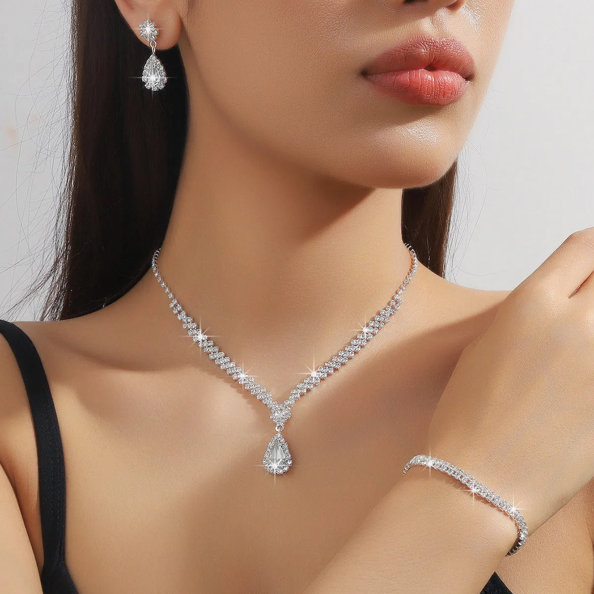 Claw chain necklace and earrings set with water drop rhinestone shapes in multiple colour options