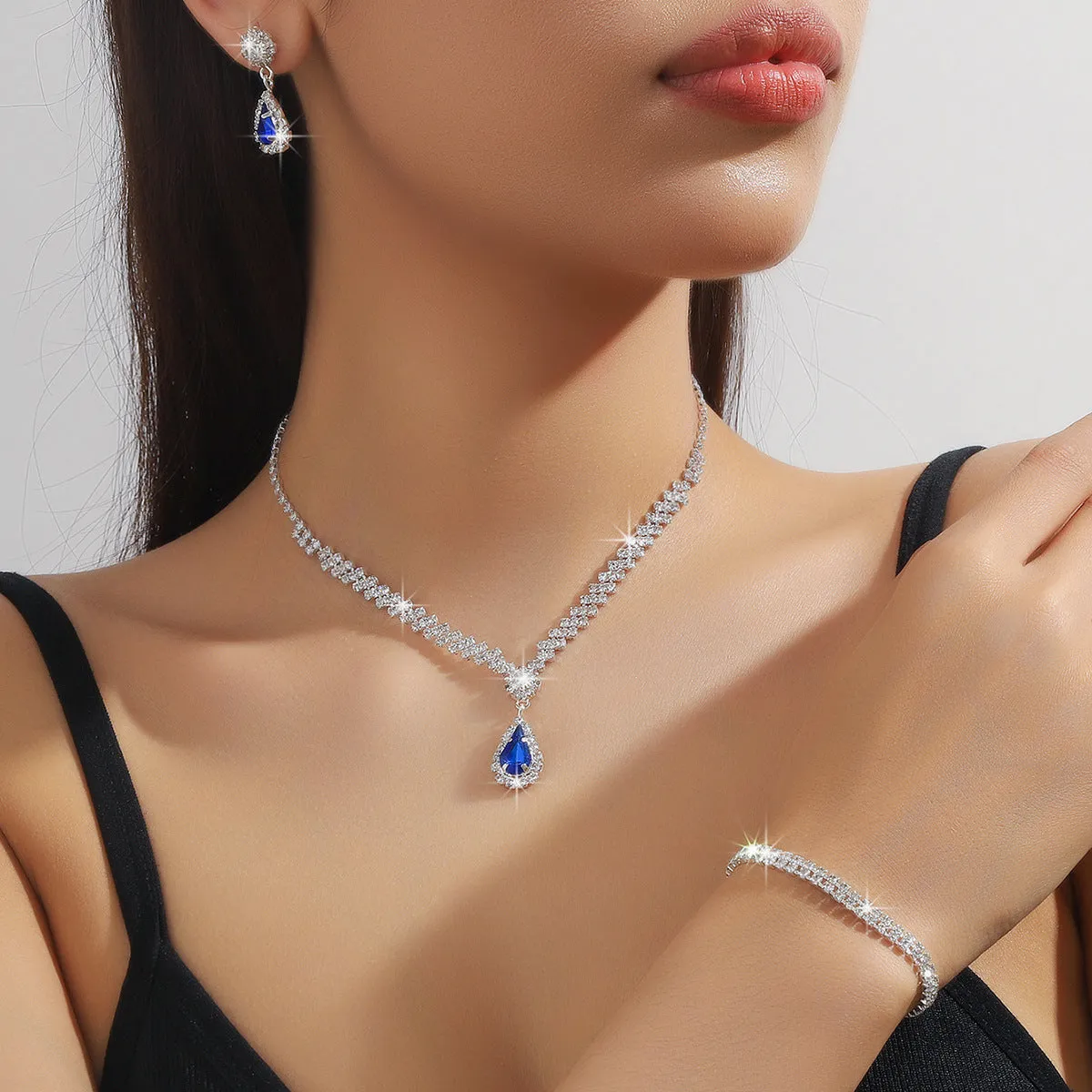 Claw chain necklace and earrings set with water drop rhinestone shapes in multiple colour options
