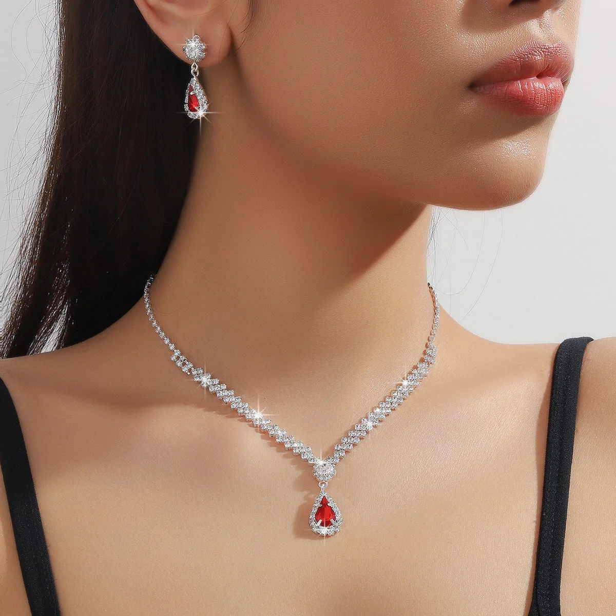 Claw chain necklace and earrings set with water drop rhinestone shapes in multiple colour options