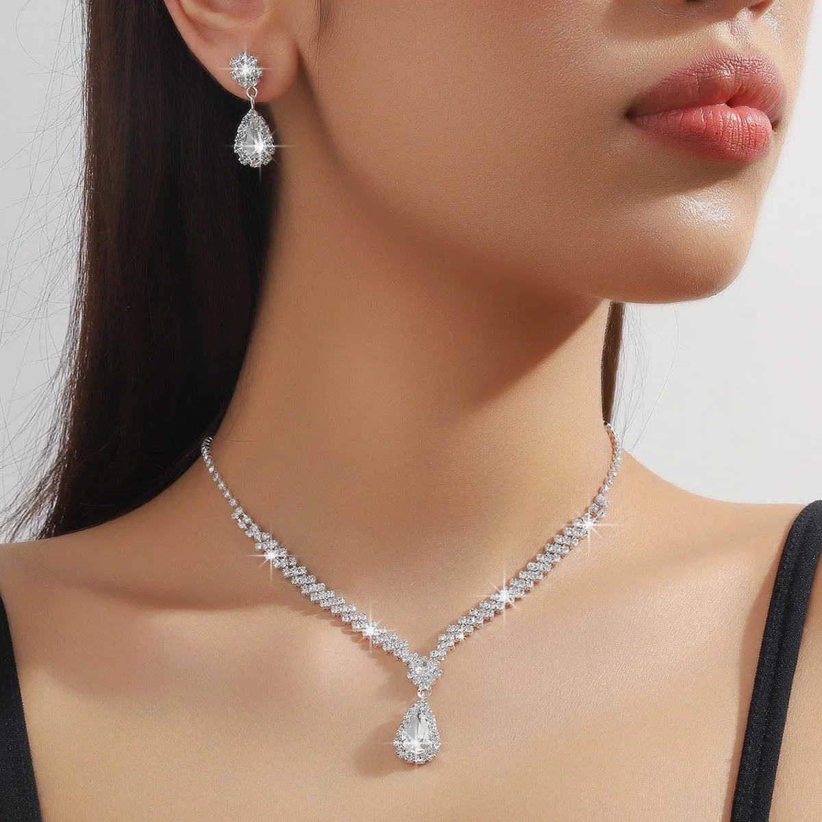 Claw chain necklace and earrings set with water drop rhinestone shapes in multiple colour options