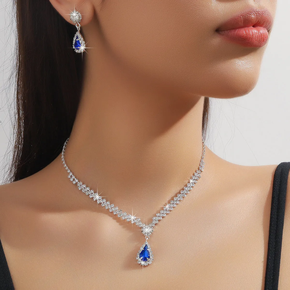 Claw chain necklace and earrings set with water drop rhinestone shapes in multiple colour options