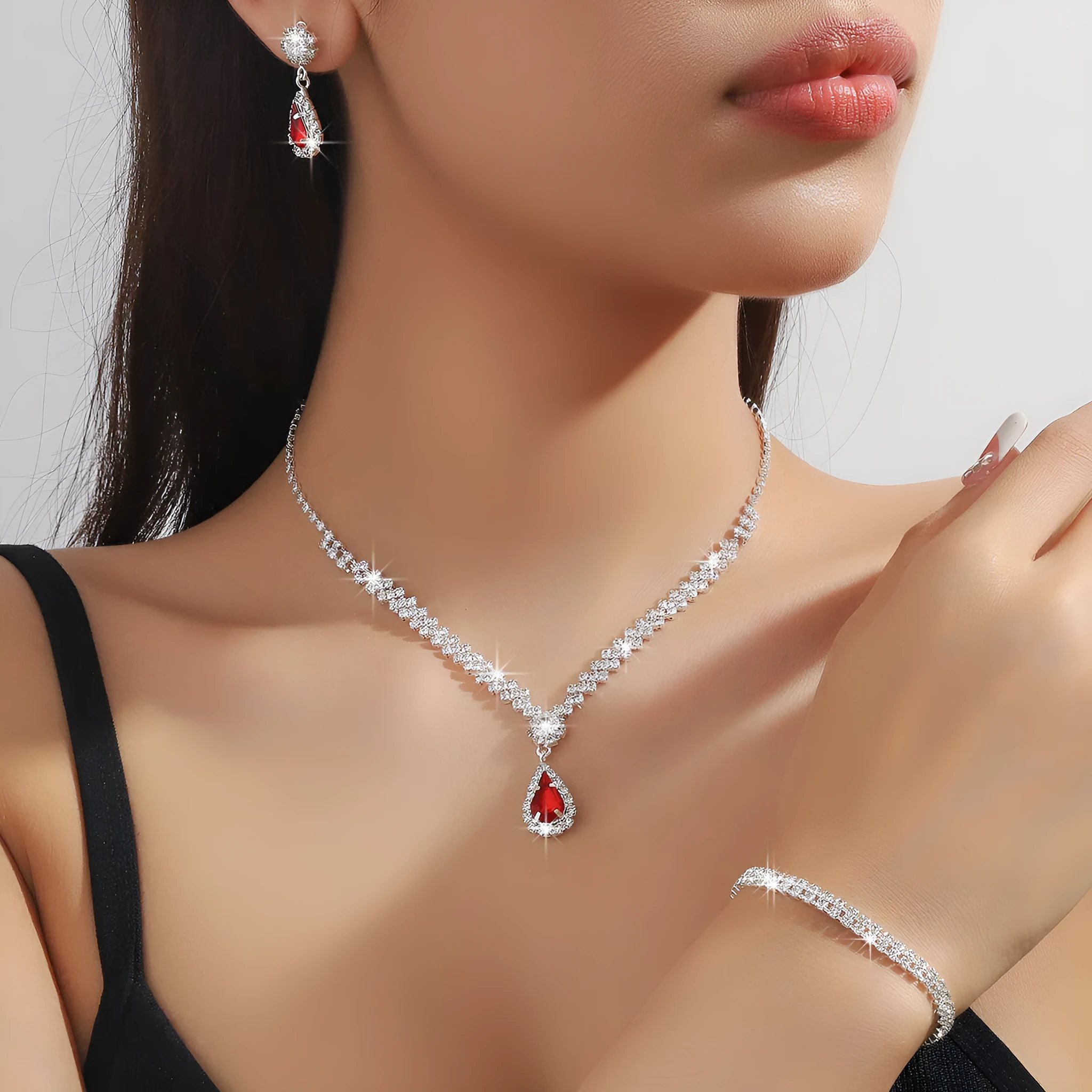 Claw chain necklace and earrings set with water drop rhinestone shapes in multiple colour options