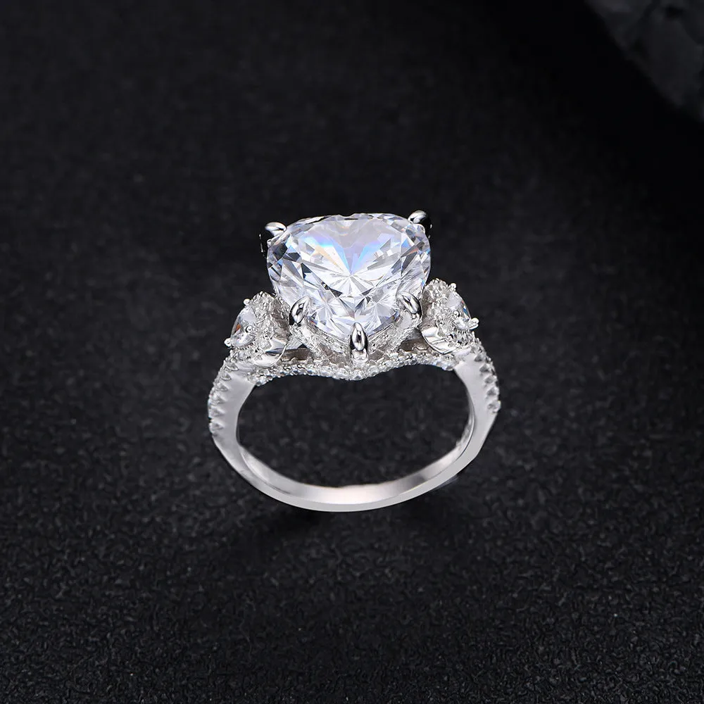 Heart-shaped diamond ring on white background, 925 silver band, open inlay setting