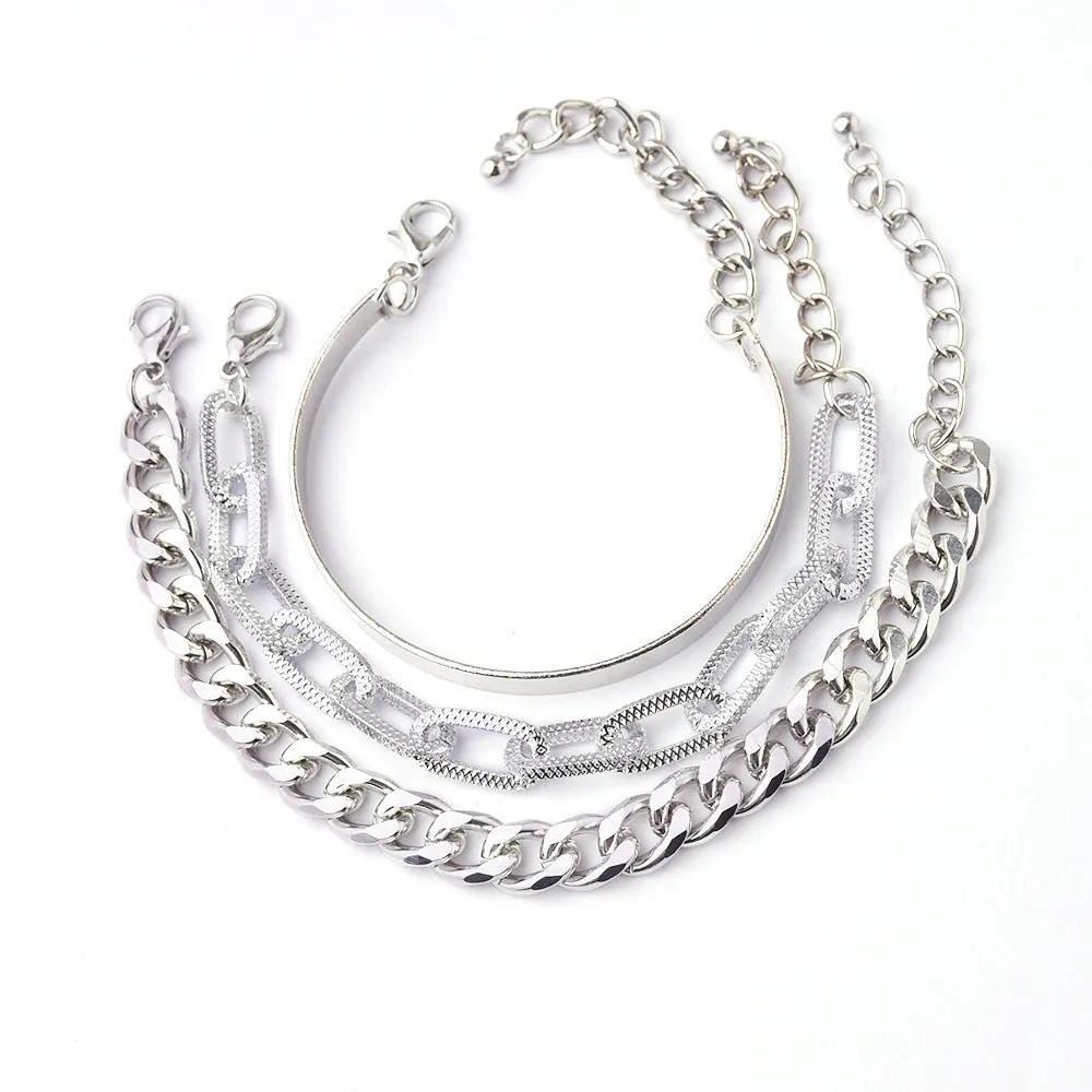 Set of 6 women's stretch bracelets with natural glass stones and gold beads arranged on a white surface