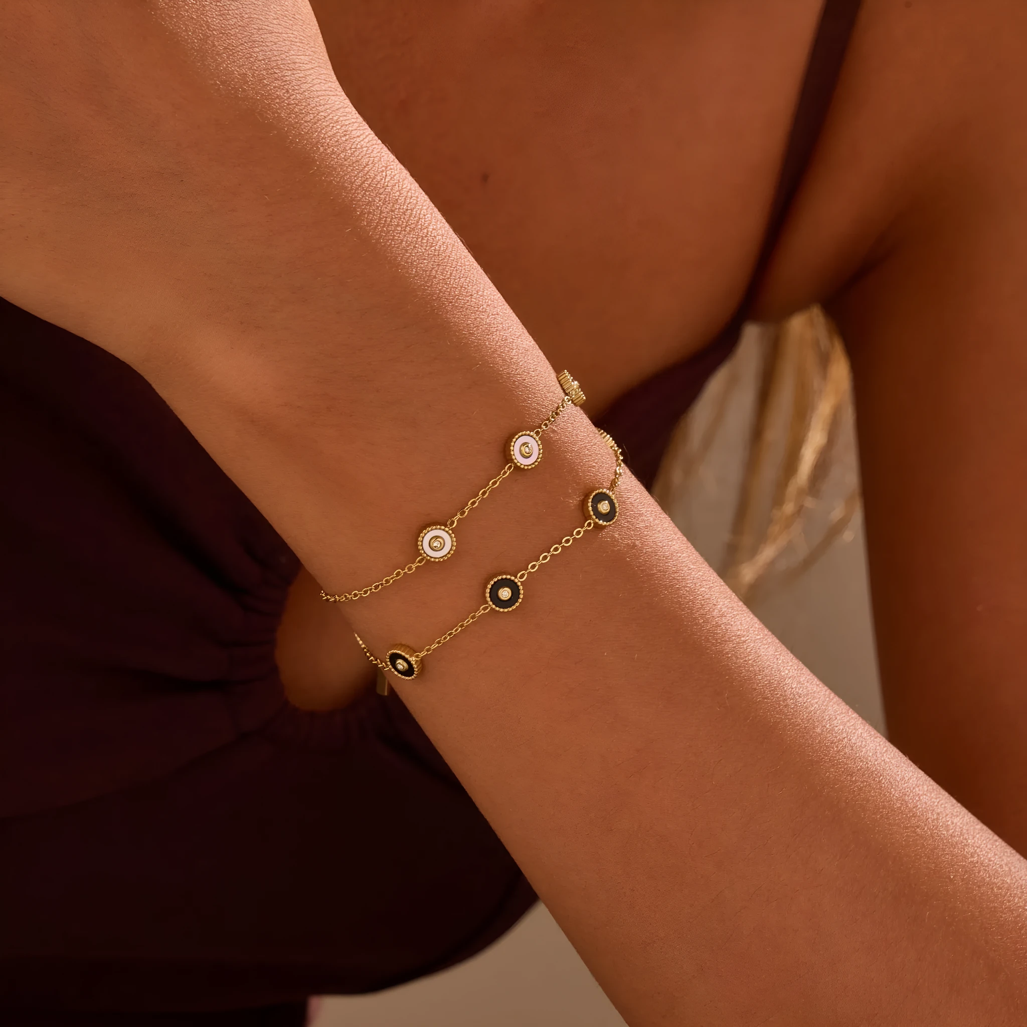 Women's stainless steel bracelet with 18K gold plating and geometric fritillary charm, includes matching necklace