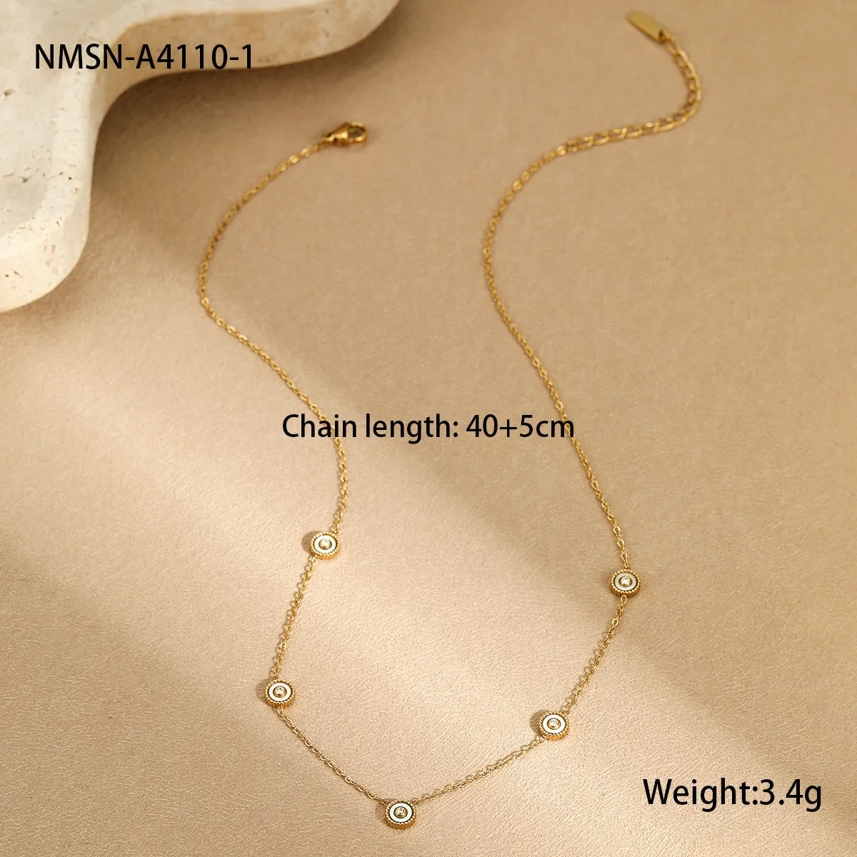 Women's stainless steel bracelet with 18K gold plating and geometric fritillary charm, includes matching necklace