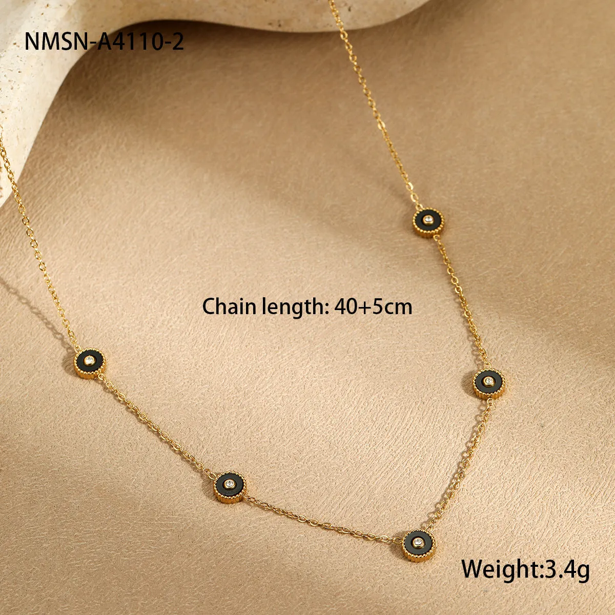 Women's stainless steel bracelet with 18K gold plating and geometric fritillary charm, includes matching necklace