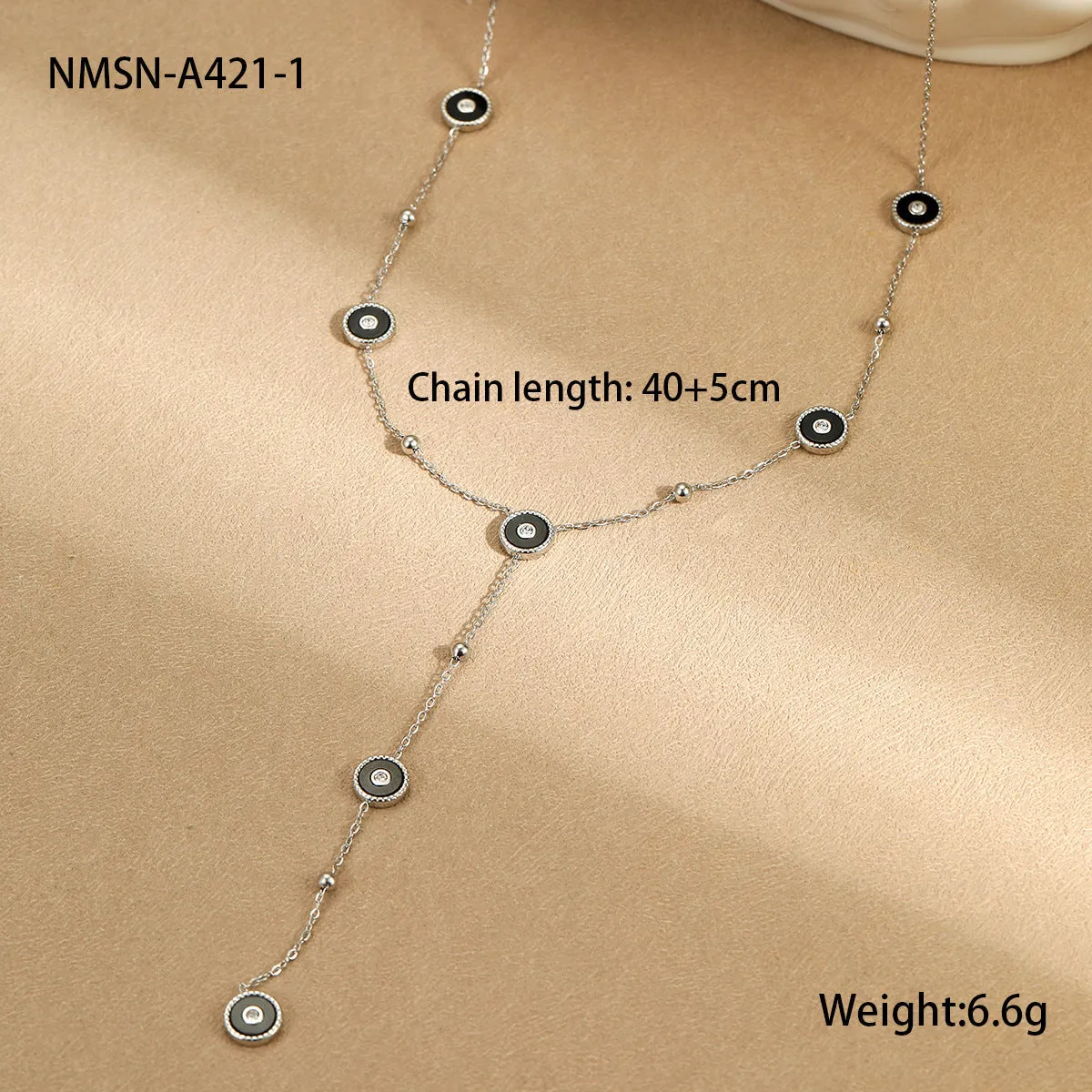 Women's stainless steel bracelet with 18K gold plating and geometric fritillary charm, includes matching necklace