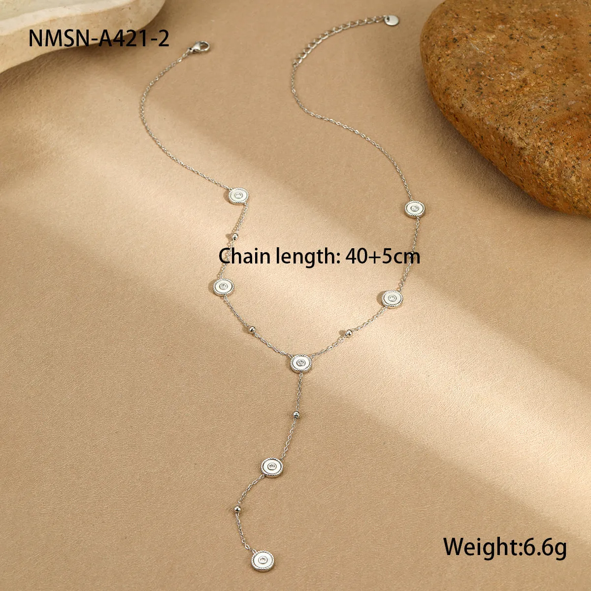 Women's stainless steel bracelet with 18K gold plating and geometric fritillary charm, includes matching necklace