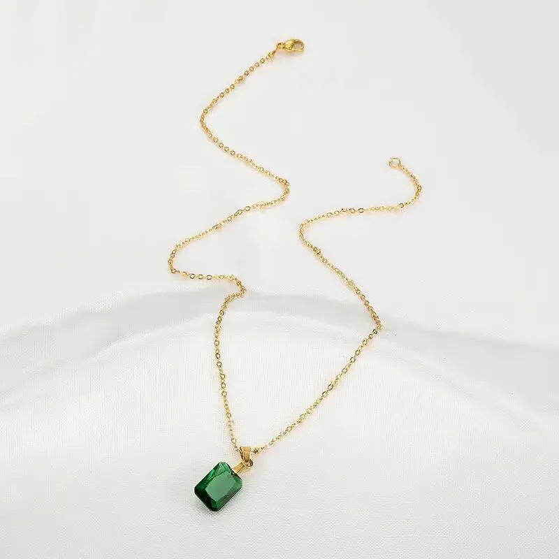 Copper geometric rectangular pendant necklace in XL1006 green on an O-ring chain.