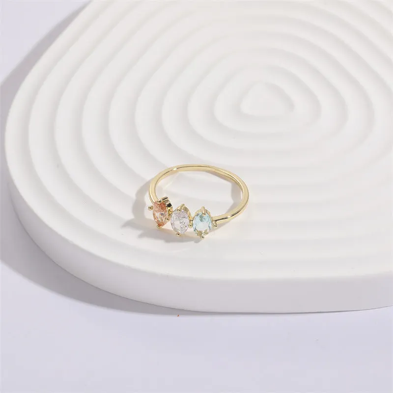 Mother's Day birthstone ring with geometric triangle design and horse eye tricolour zircon stones in 14k gold colour