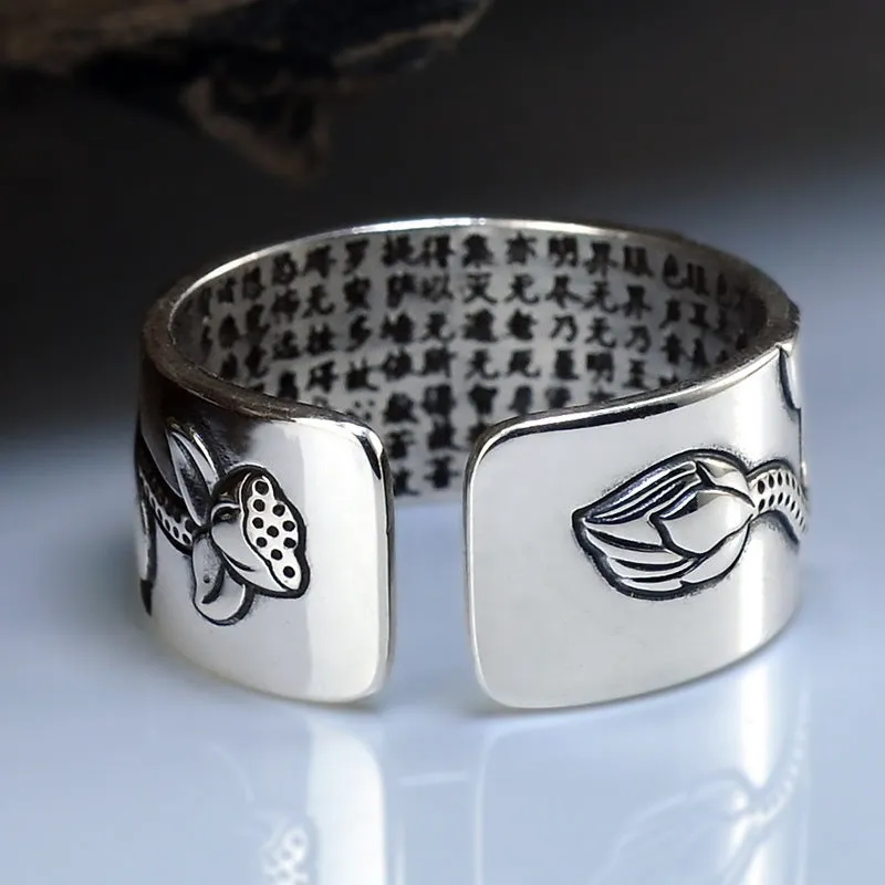 Thai silver black Lotus Heart Sutra ring with retro geometric pattern and matte oiling finish on grey background