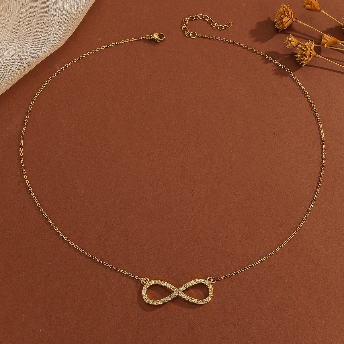 Gold plated copper diamond infinity symbol love pendant necklace with sparkling stones on fine chain