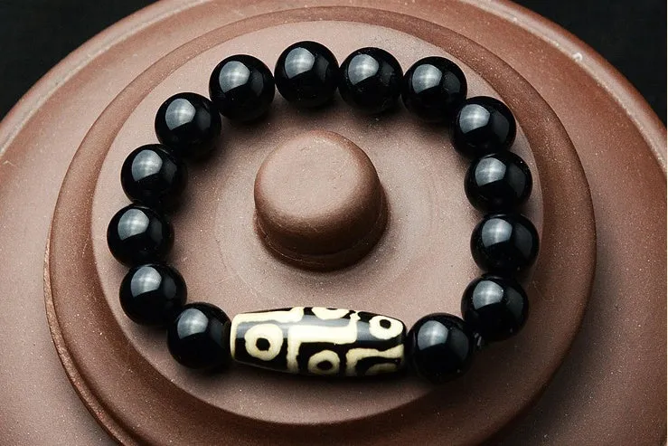 Natural black agate bracelet with nine eyes beads on neutral background, three size options 10mm 12mm 14mm